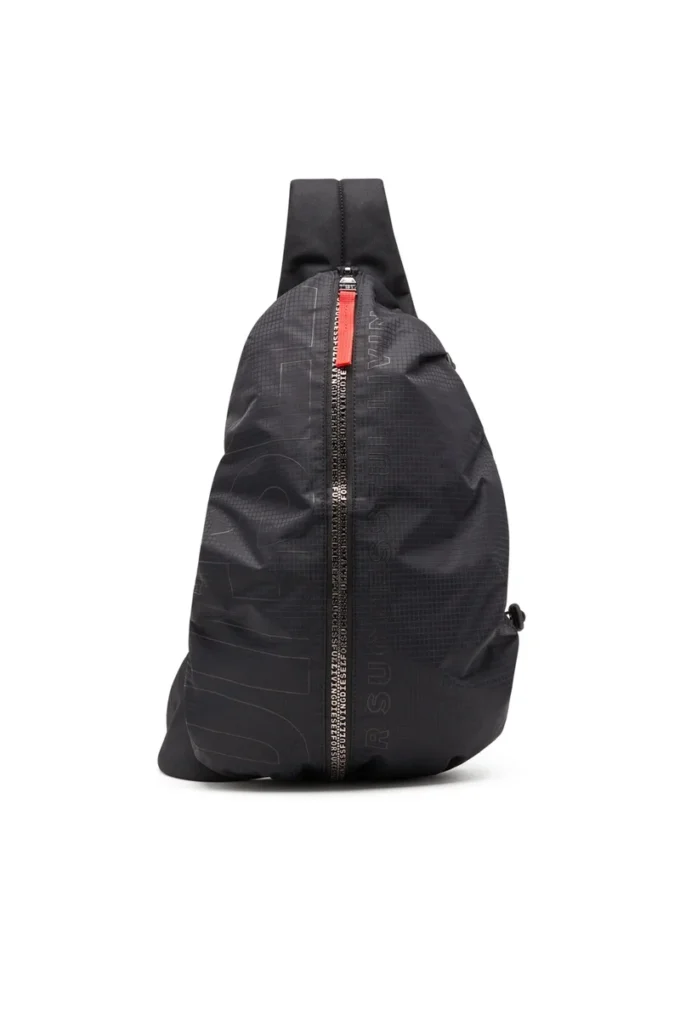 Borsa a tracolla zip-d x Zaino Zip-D-Sling in tessuto jacquard a quadri Borsa a tracolla zip-d x Zaino Zip-D-Sling in tessuto jacquard a quadri