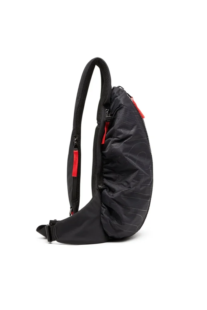 Borsa a tracolla zip-d x Zaino Zip-D-Sling in tessuto jacquard a quadri Borsa a tracolla zip-d x Zaino Zip-D-Sling in tessuto jacquard a quadri