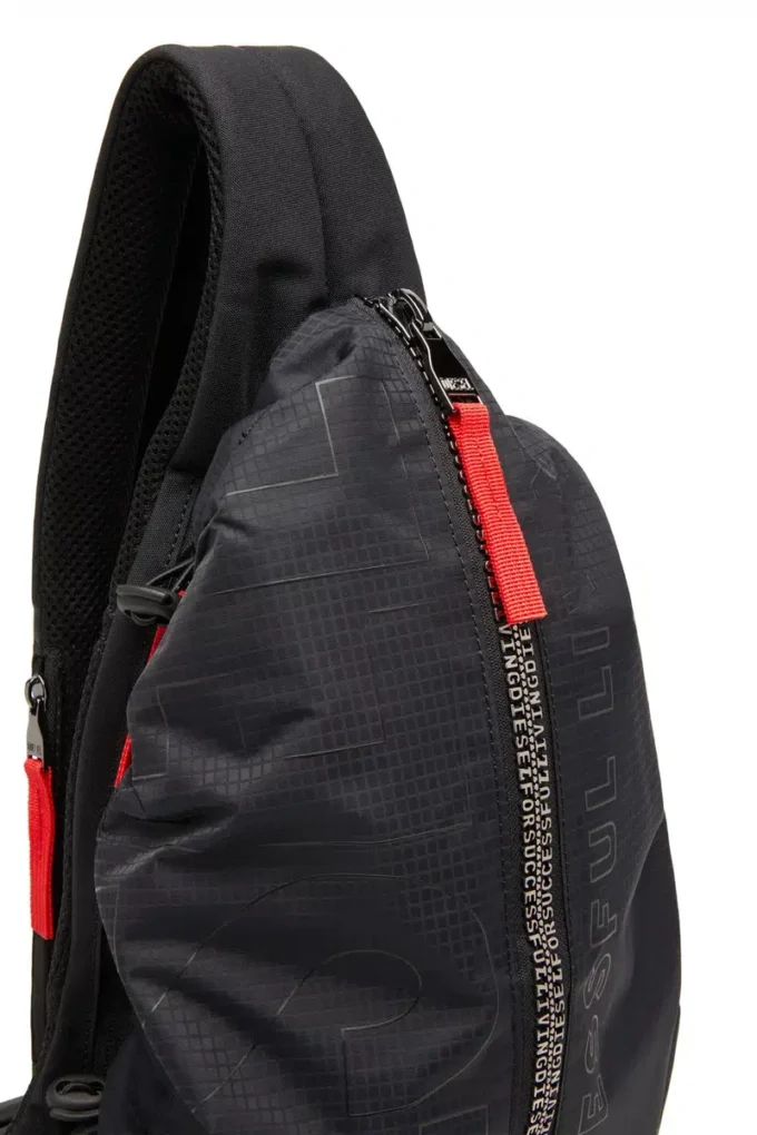 Borsa a tracolla zip-d x Zaino Zip-D-Sling in tessuto jacquard a quadri Borsa a tracolla zip-d x Zaino Zip-D-Sling in tessuto jacquard a quadri