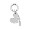 ciondolo-cuore Ciondolo a forma di cuore in metallo con strass ciondolo-cuore Ciondolo a forma di cuore in metallo con strass